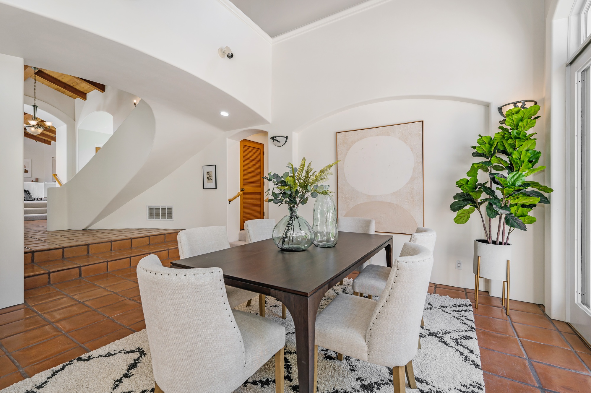 a dining room that is very clean and has tile floors
